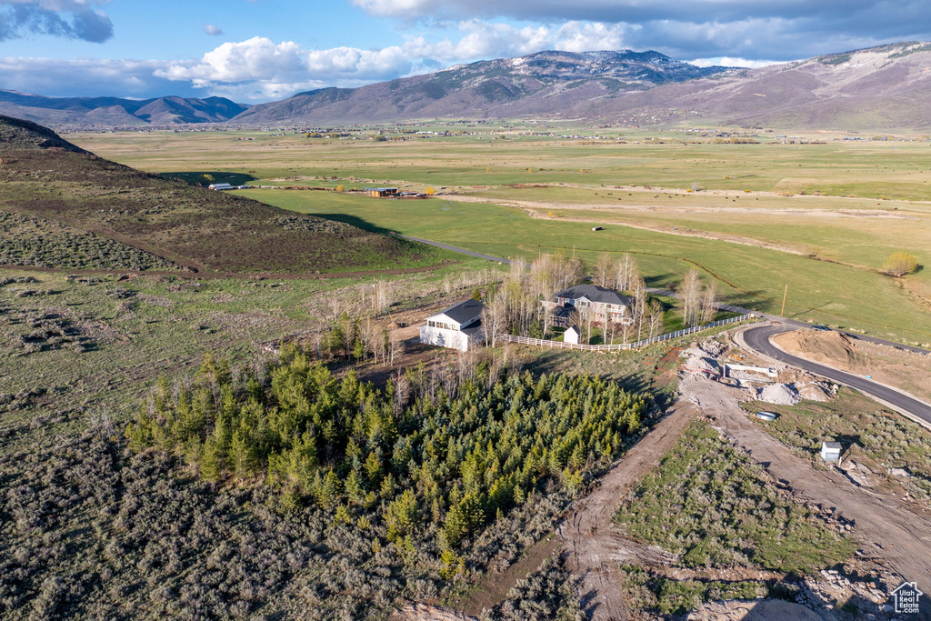 Birds eye view of property featuring a mountain view and a rural view