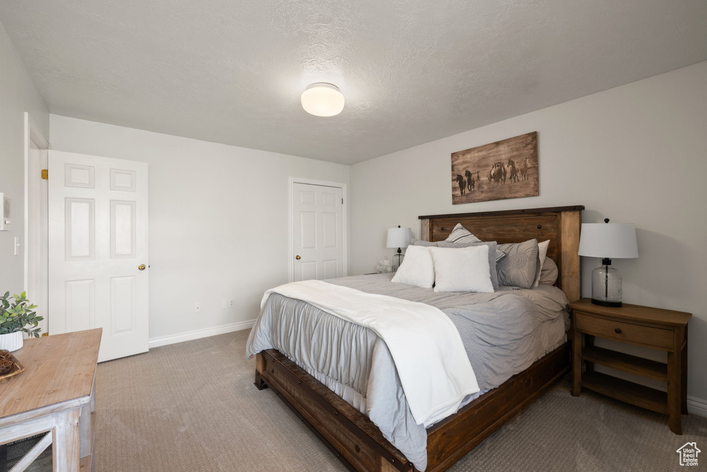 Carpeted bedroom with baseboards