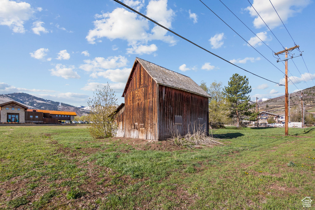View of outbuilding with a mountain view and an outbuilding