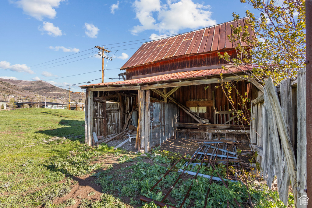 View of outbuilding with an outdoor structure and a mountain view