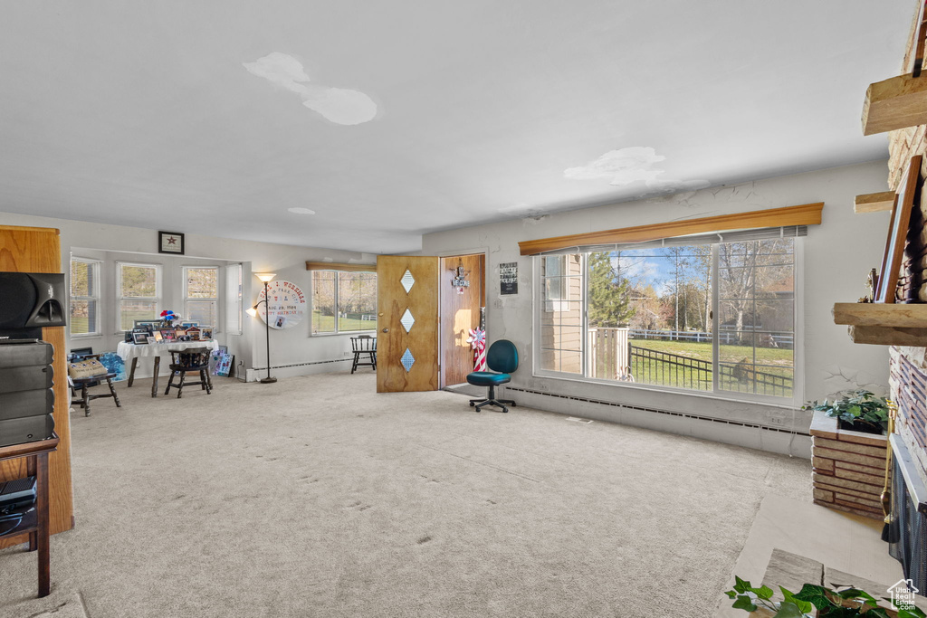 Unfurnished living room with a fireplace and carpet flooring