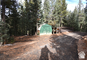 Exterior space with a wooded view