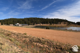 Exterior space with a water view and a forest view