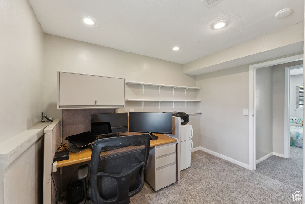 Office space featuring light colored carpet, recessed lighting, and baseboards