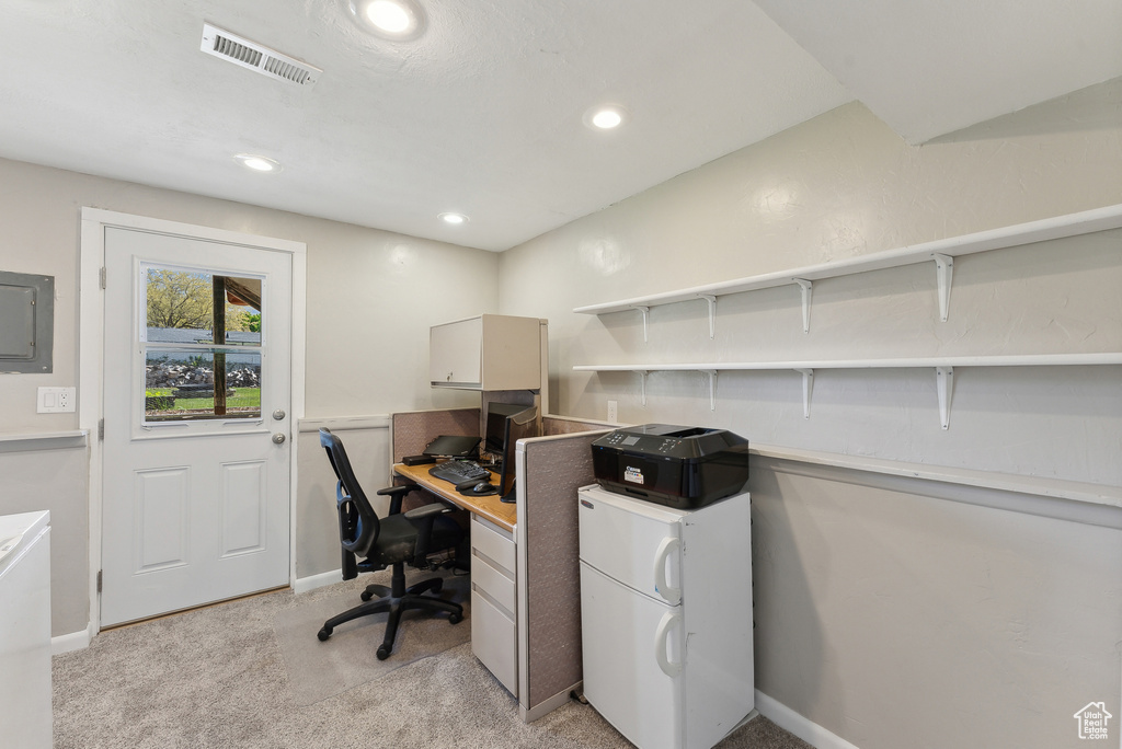 Office space featuring light colored carpet, baseboards, visible vents, and recessed lighting