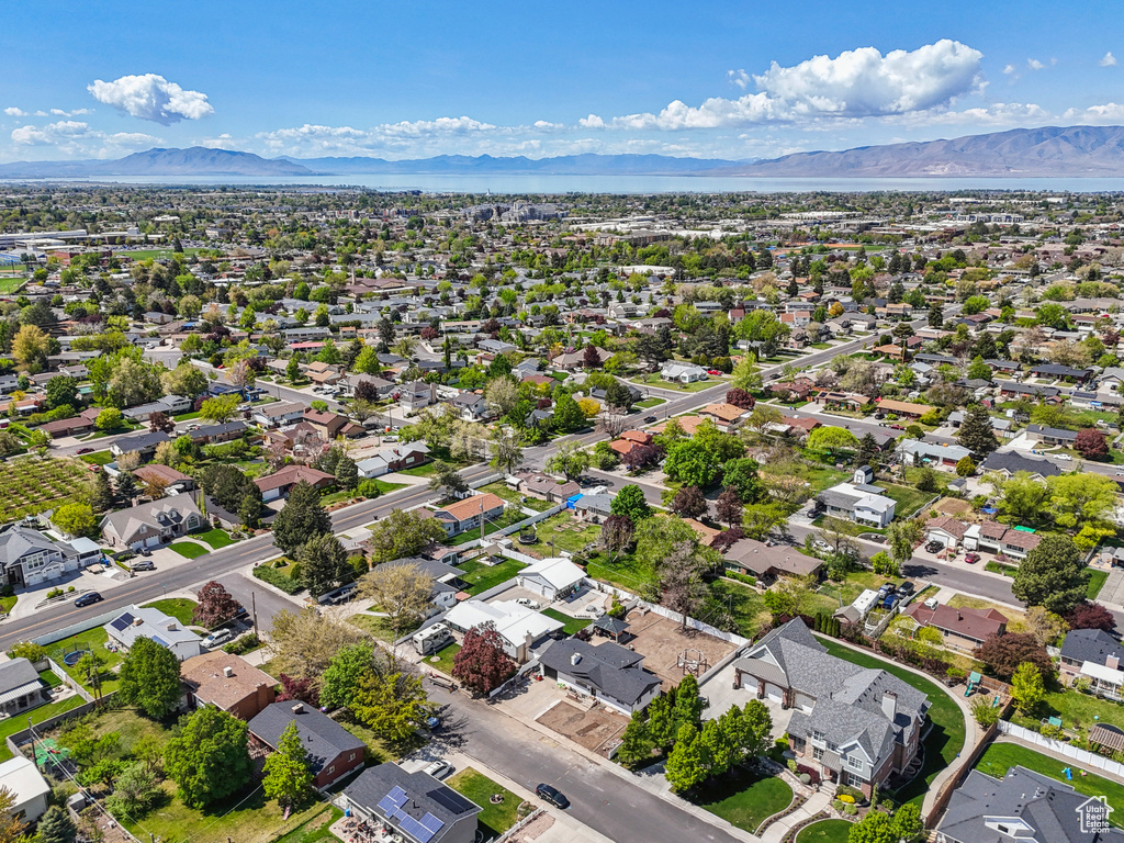 Birds eye view of property with a mountain view and a residential view