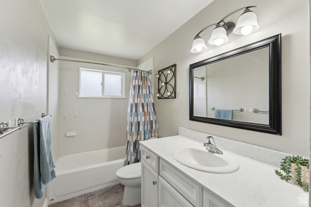 Full bath featuring toilet, shower / tub combo, and vanity