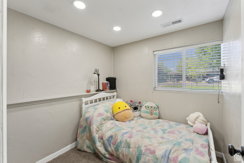 Carpeted bedroom with recessed lighting, baseboards, and visible vents