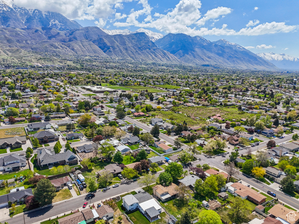 Birds eye view of property with a residential view and a mountain view