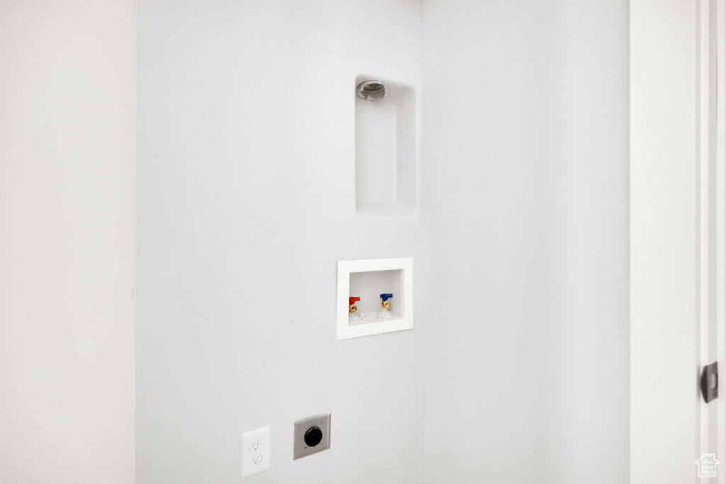 Laundry area featuring laundry area, electric dryer hookup, and hookup for a washing machine