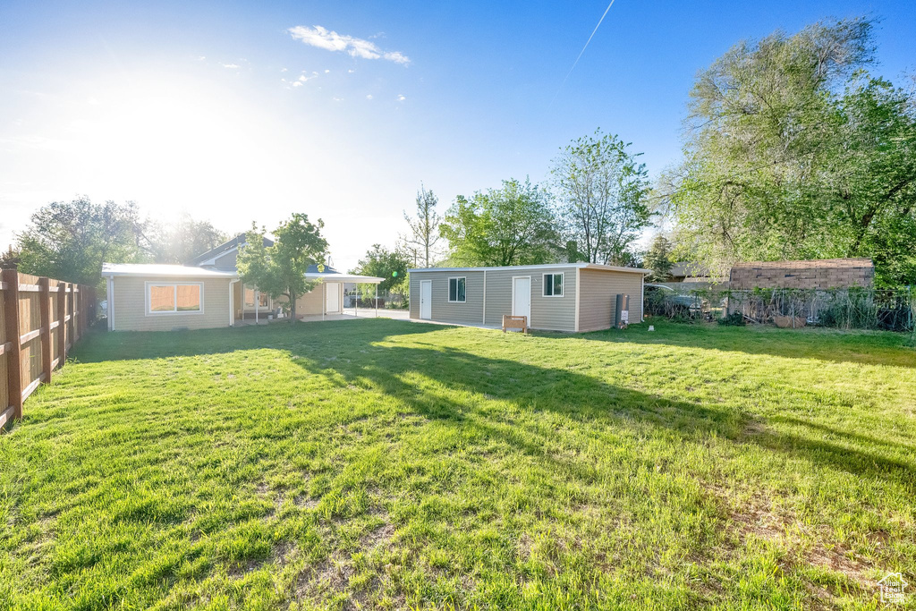 View of yard featuring fence