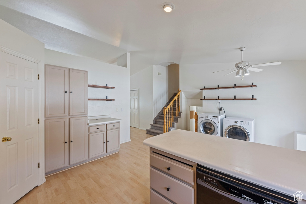 Kitchen featuring washer and dryer, open shelves, ceiling fan, light wood finished floors, and dishwasher