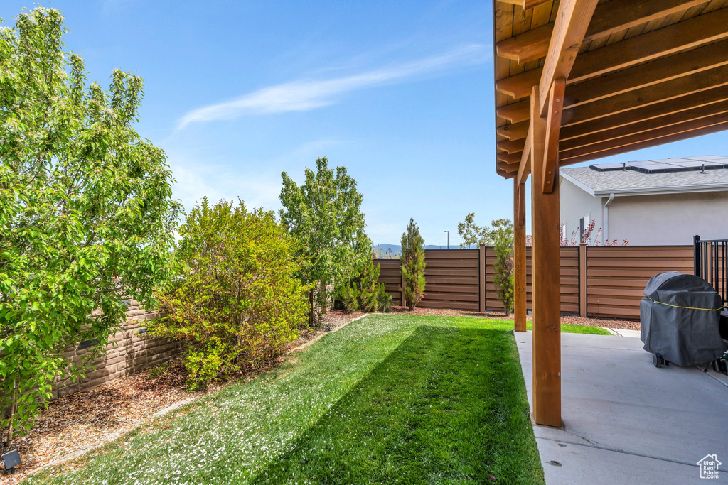 View of yard featuring a fenced backyard and a patio area