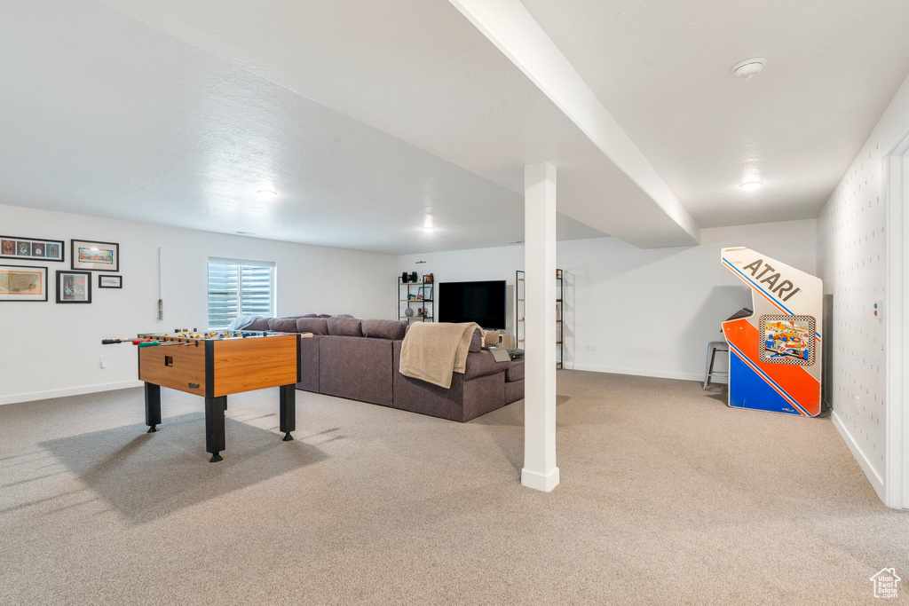 Playroom with baseboards and carpet