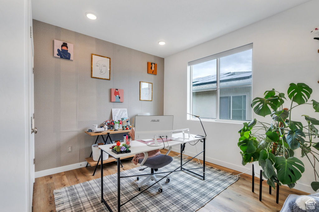 Home office featuring baseboards, recessed lighting, and light wood-style flooring