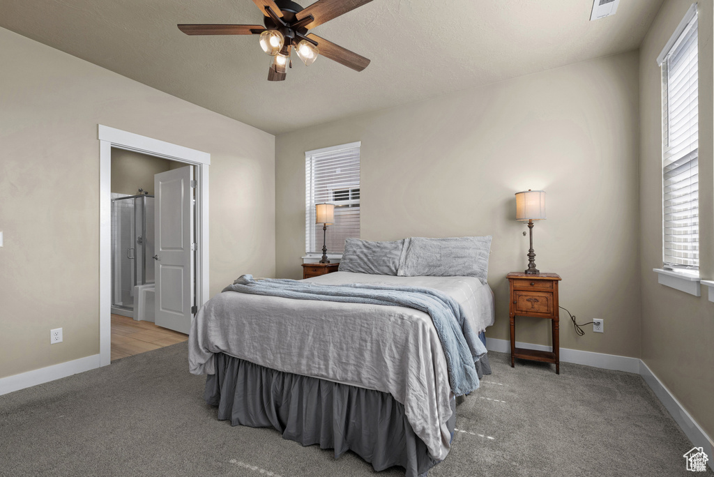Bedroom featuring baseboards, a ceiling fan, carpet flooring, and visible vents