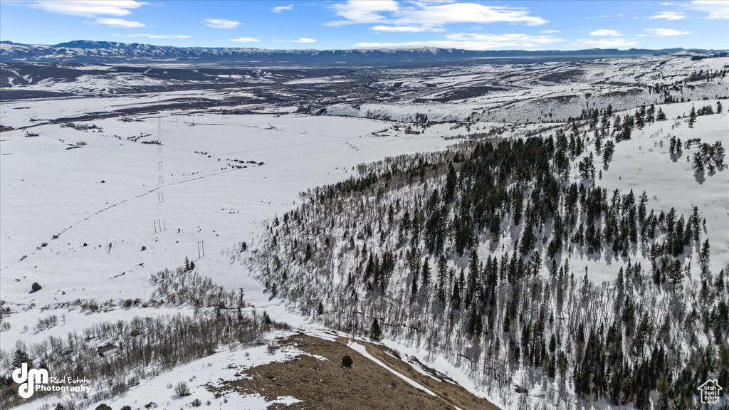 Snowy aerial view with a mountain view