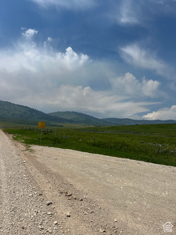 View of mountain background featuring rural landscape