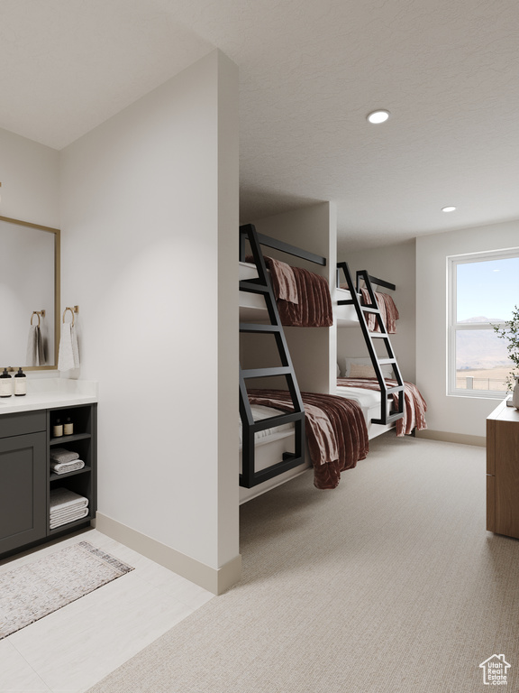 Bedroom with baseboards, light carpet, and recessed lighting