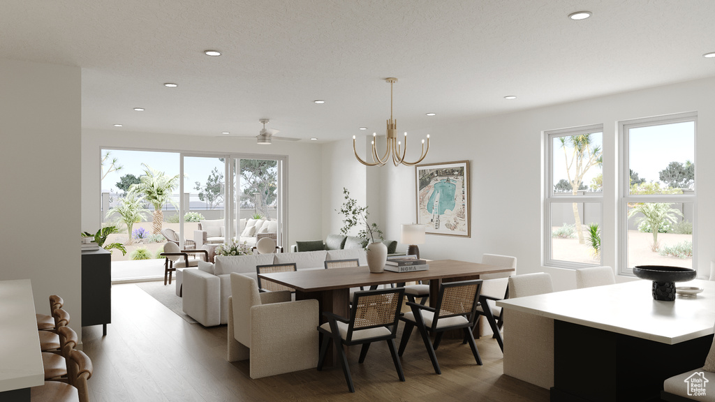 Dining area with recessed lighting, wood finished floors, and a healthy amount of sunlight