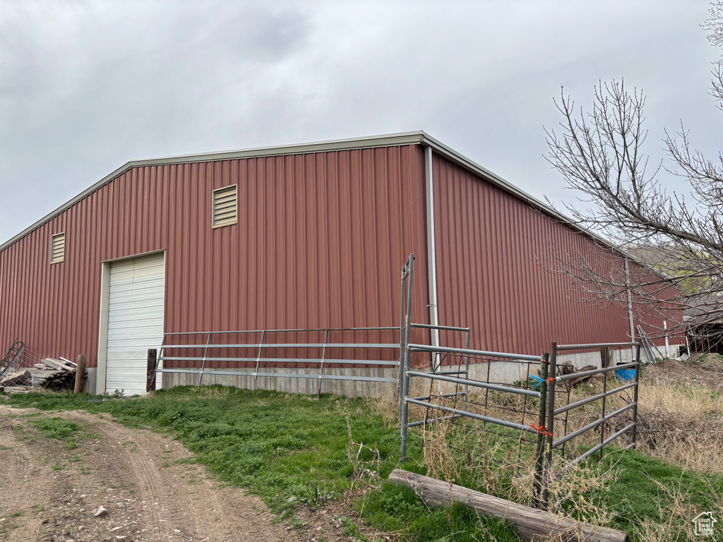 View of pole building with fence