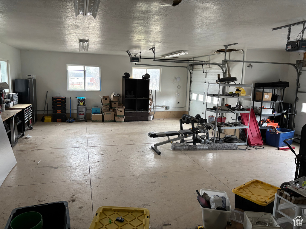 Garage featuring a garage door opener