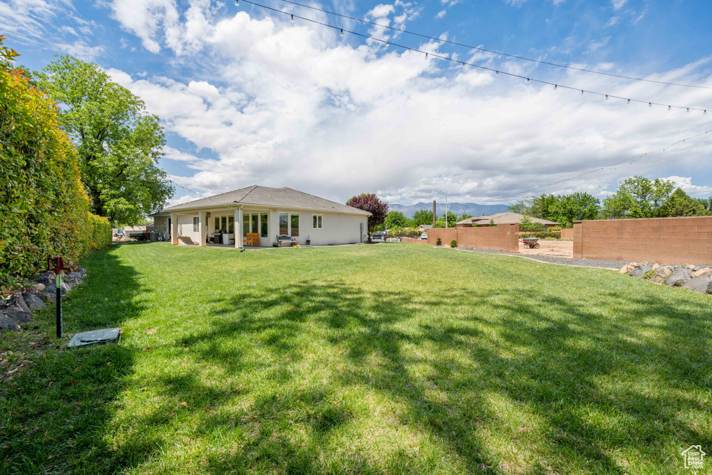 View of yard with fence