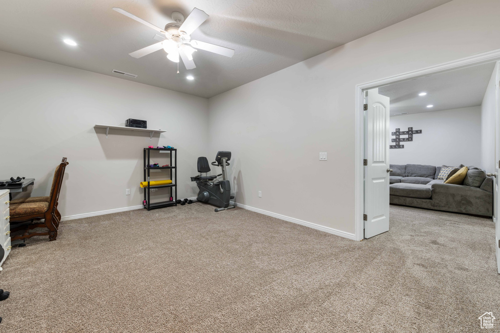 Carpeted office with visible vents, a ceiling fan, baseboards, and recessed lighting