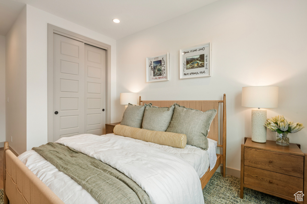 Carpeted bedroom with a closet and recessed lighting