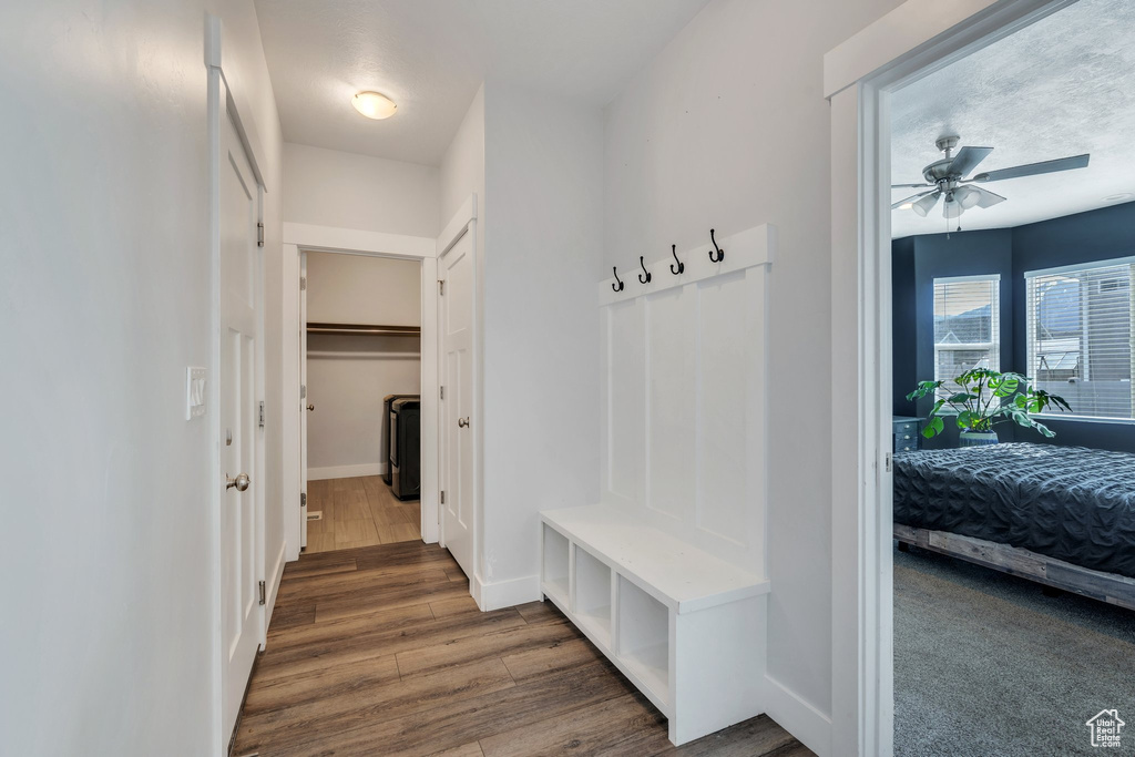 Mudroom with baseboards, a ceiling fan, and wood finished floors