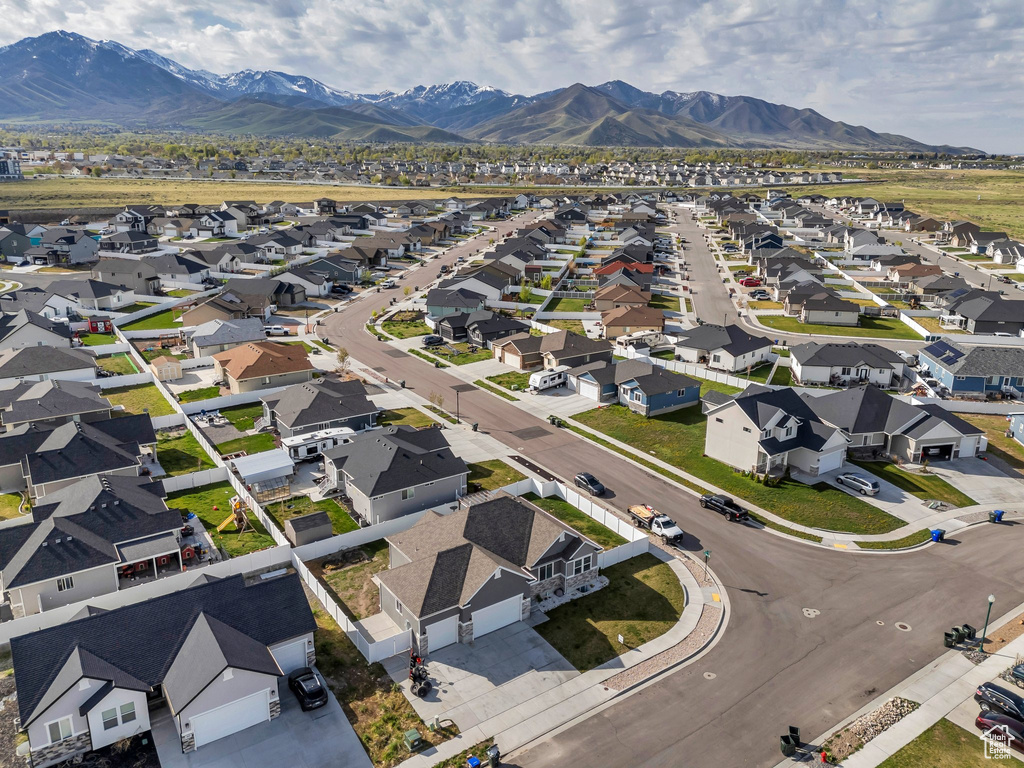 Drone / aerial view with a residential view and a mountain view