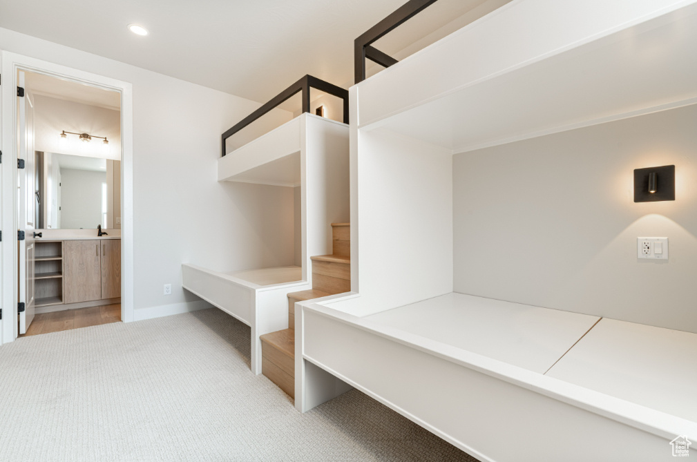Mudroom featuring carpet floors and baseboards