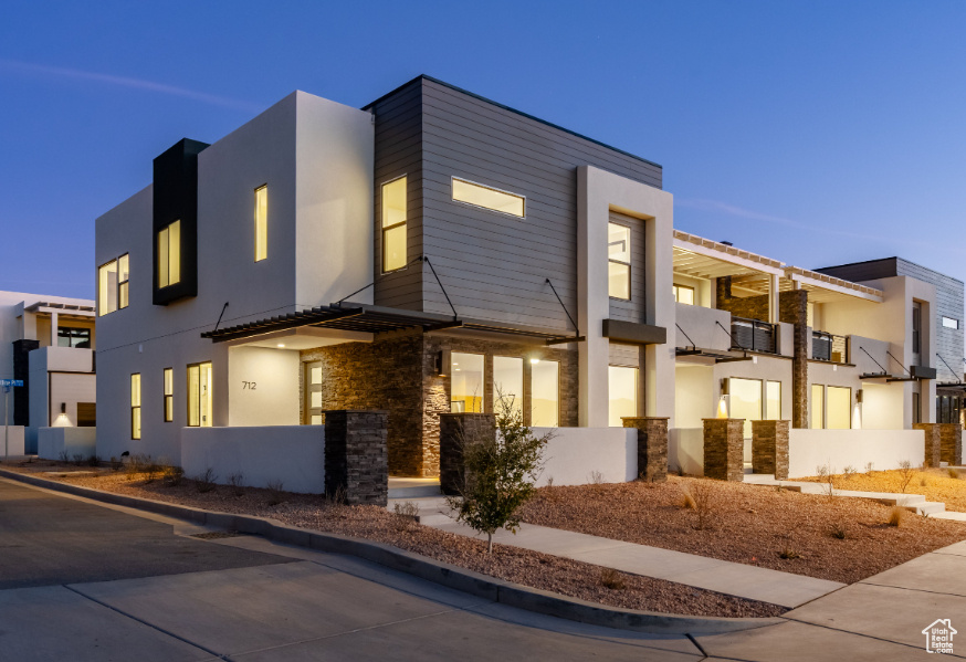 View of front of property with stucco siding and stone siding