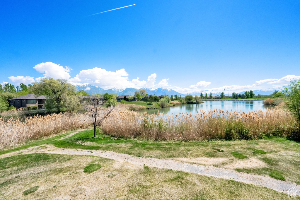 View of water feature with a mountain view
