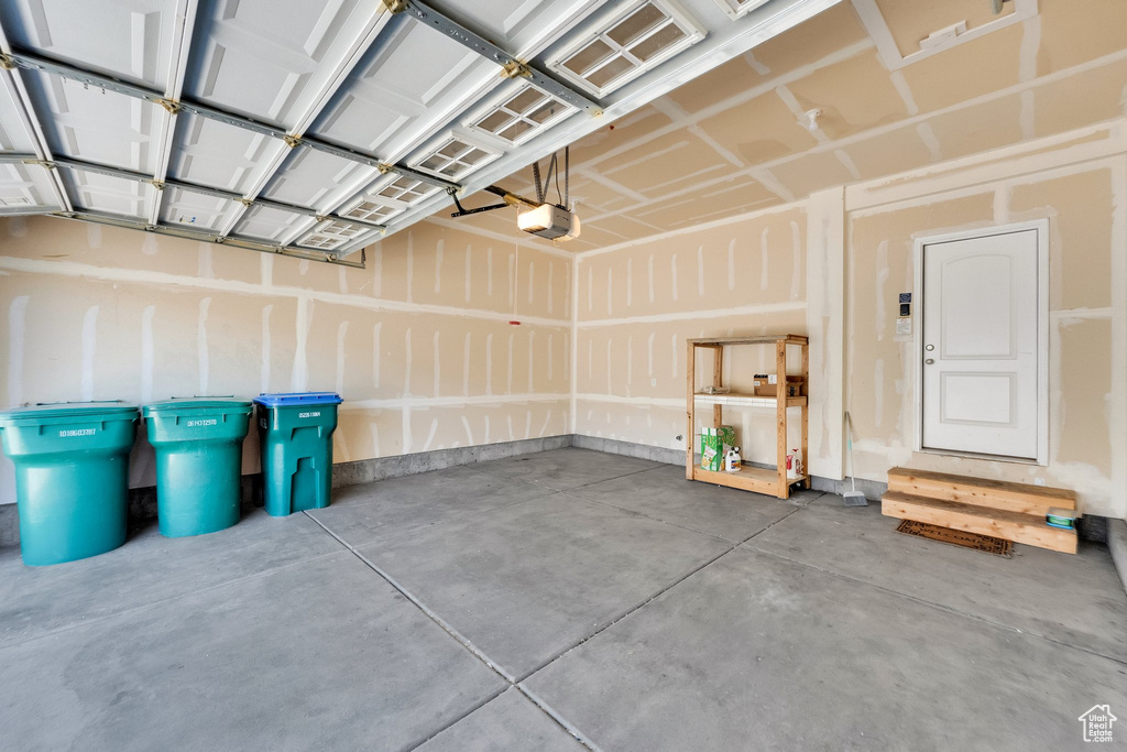 Garage featuring a garage door opener