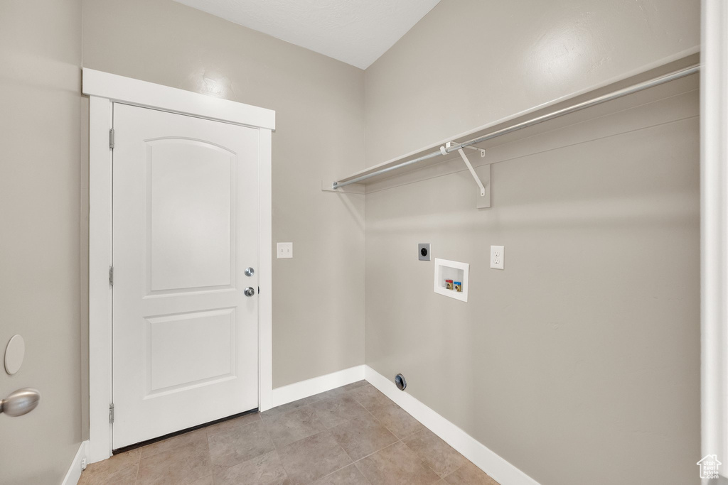Laundry area featuring washer hookup, baseboards, laundry area, and electric dryer hookup