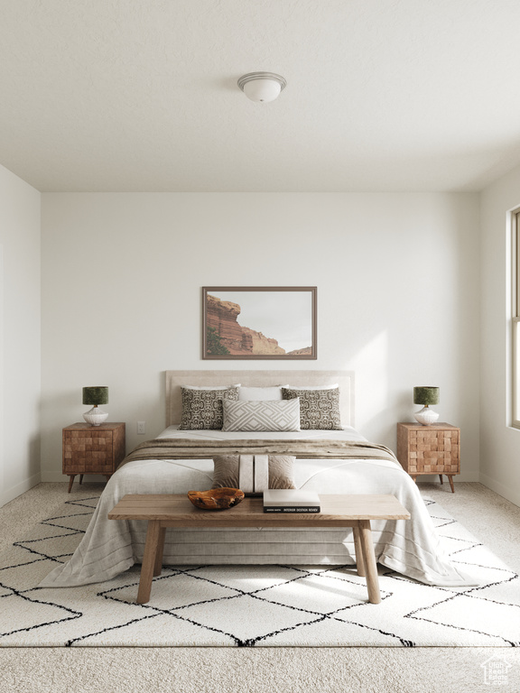 Bedroom with carpet floors and baseboards