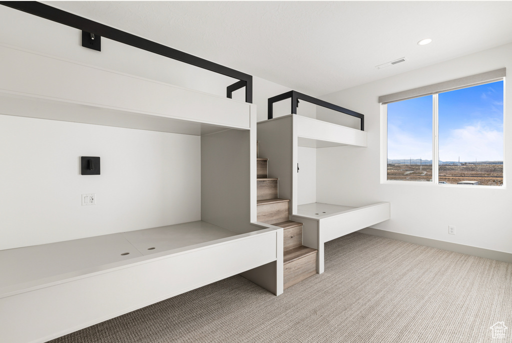 Mudroom with baseboards, carpet, and recessed lighting