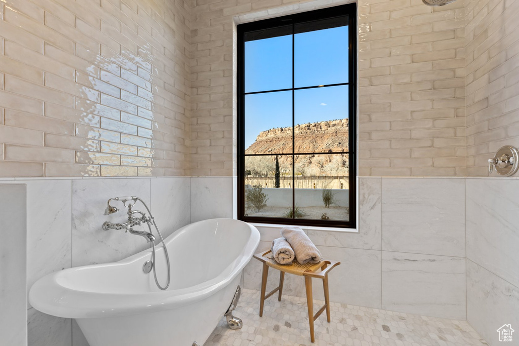 Full bathroom with a freestanding tub and a tile shower