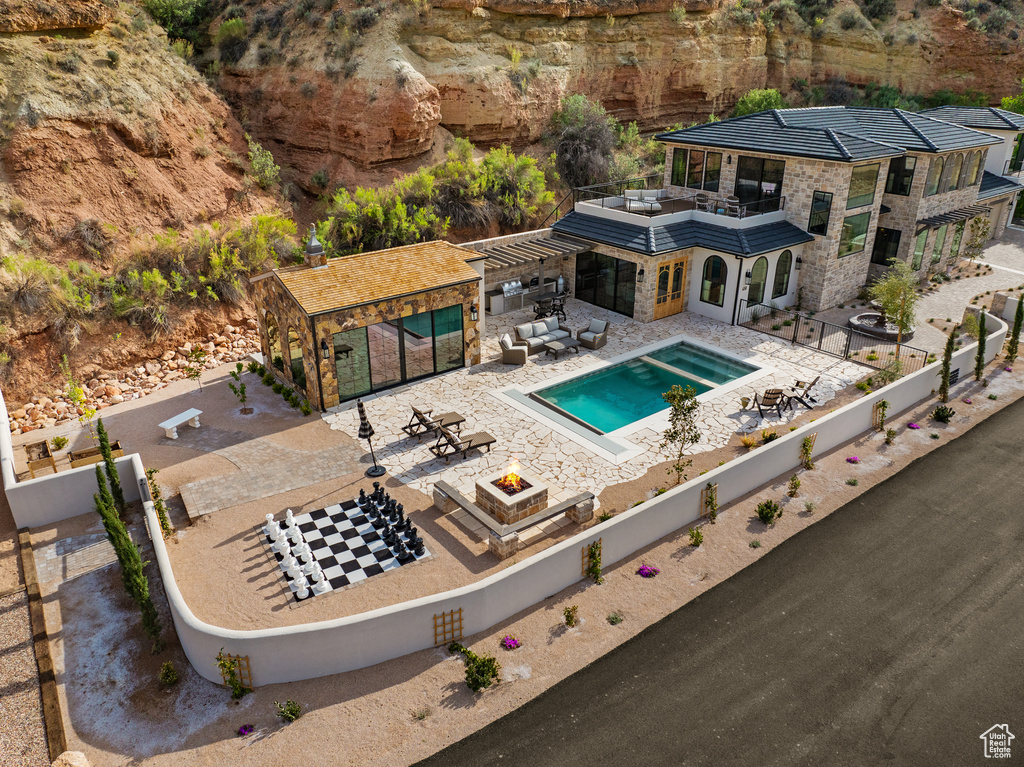 View of swimming pool with a fenced backyard, a fenced in pool, a patio, and an outdoor fire pit