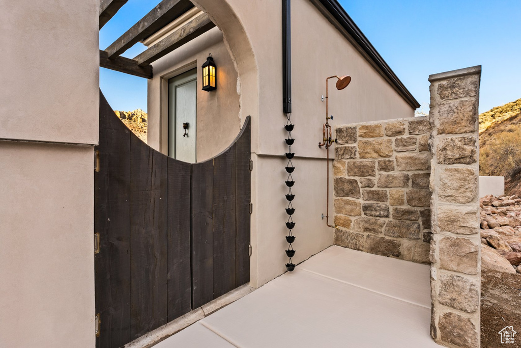 Doorway to property with stucco siding