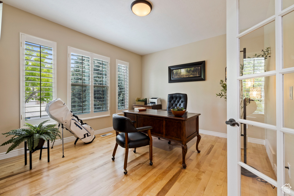 Office featuring baseboards and light wood-style flooring