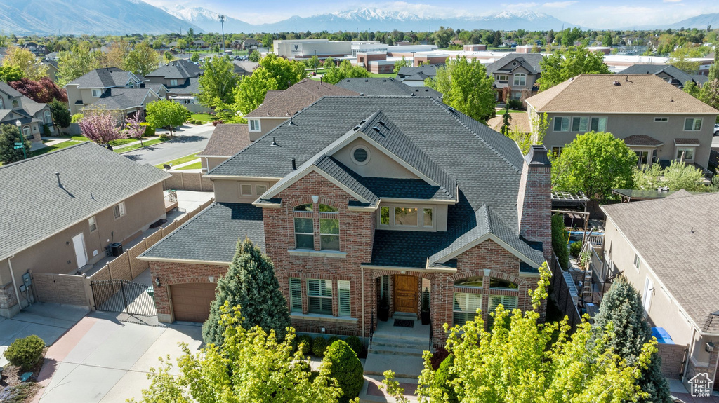 Drone / aerial view featuring a mountain view and a residential view
