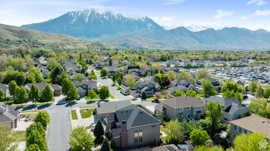 Birds eye view of property with a residential view and a mountain view
