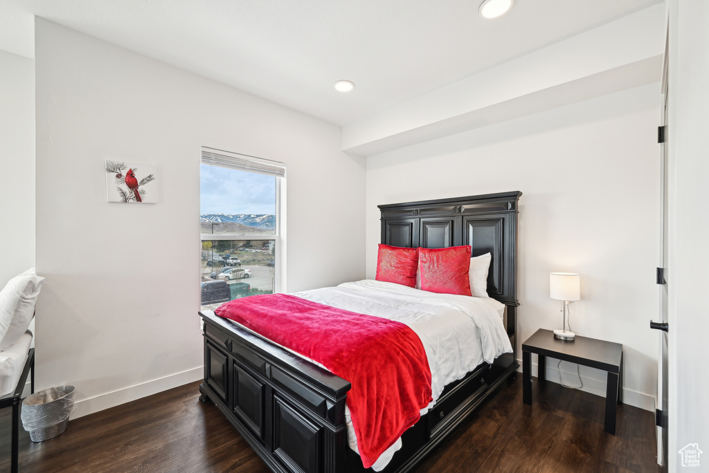 Bedroom with recessed lighting, baseboards, and dark wood-style floors
