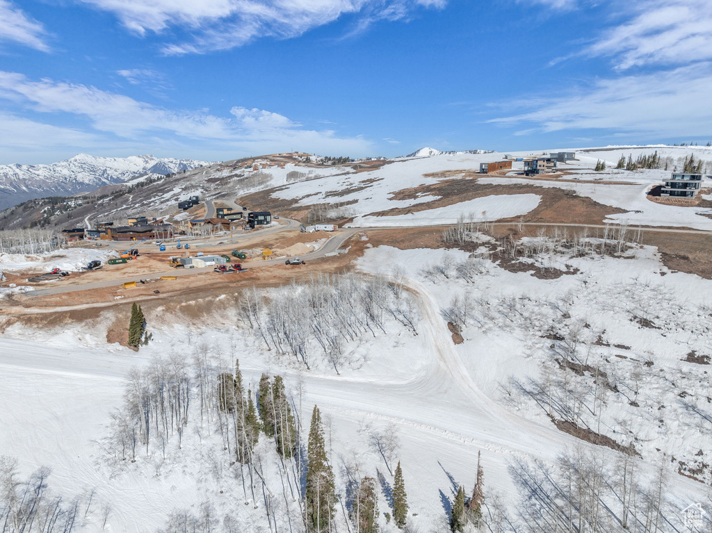 Snowy aerial view with a mountain view