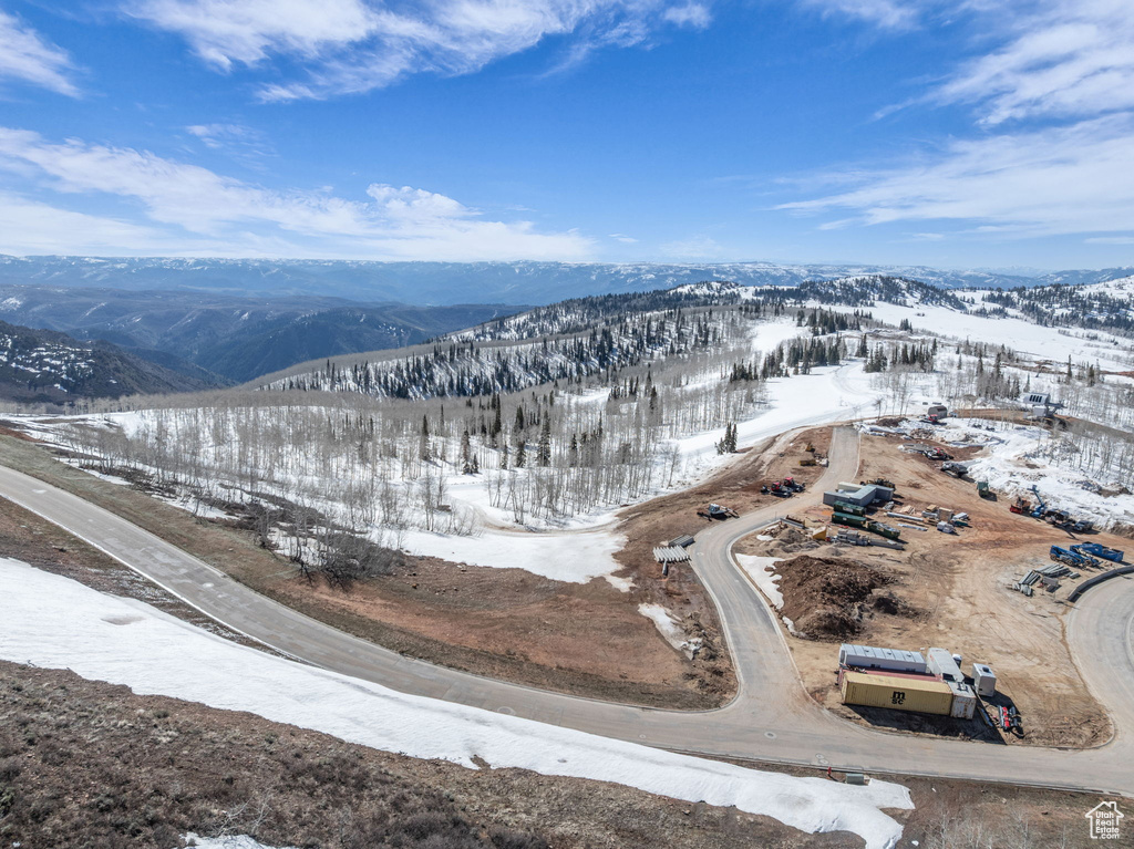 Snowy aerial view featuring a mountain view
