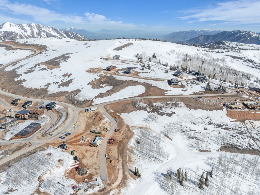 Snowy aerial view with a mountain view