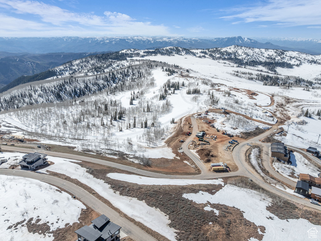 Snowy aerial view featuring a mountain view