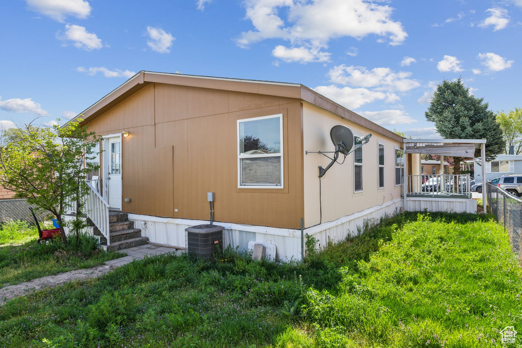 View of property exterior with central air condition unit